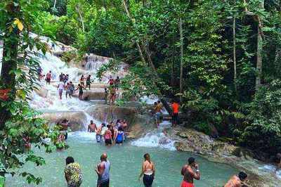 Visitors climbing Dunn's River Falls in Ocho Rios, Jamaica